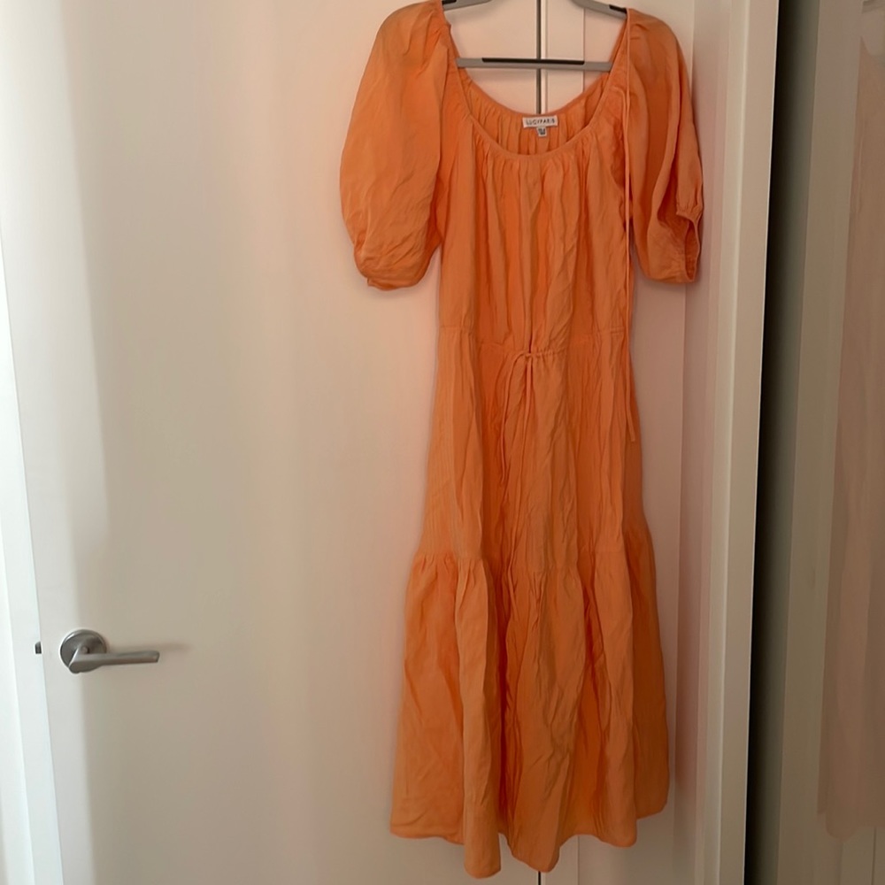 Beautiful light orange flowy maxi with a draw waist. Sizing for 8-10 medium.